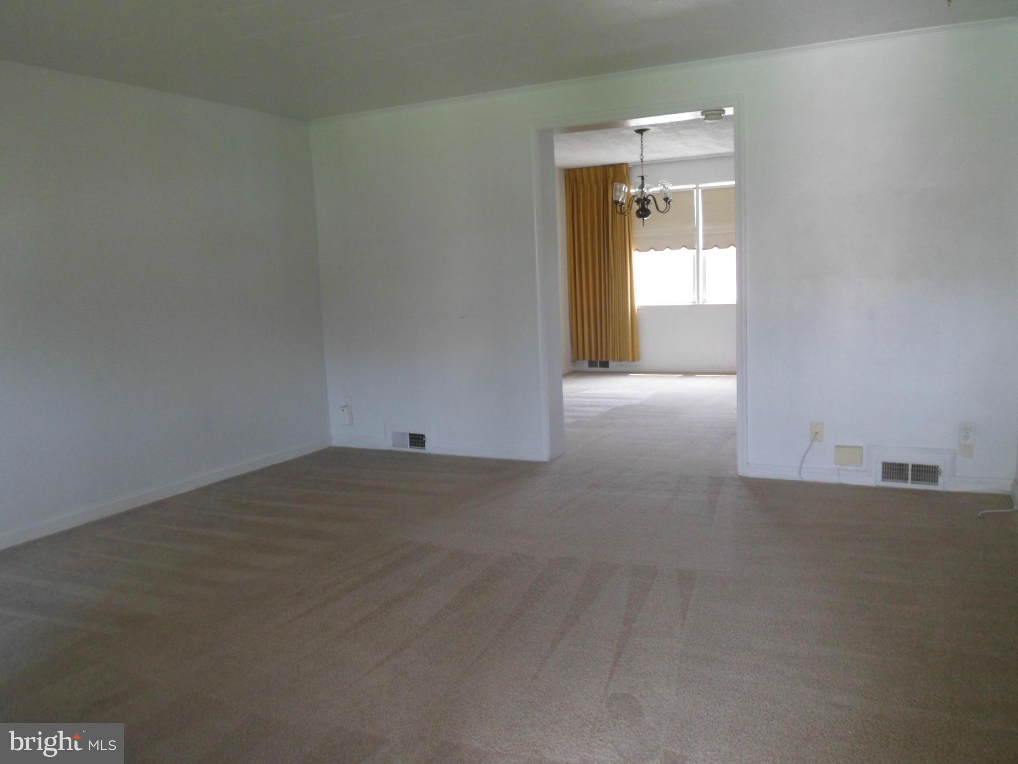 1333 Stonewood Road Baltimore, MD 21239 - Photo 7 of 30 an empty room with a window