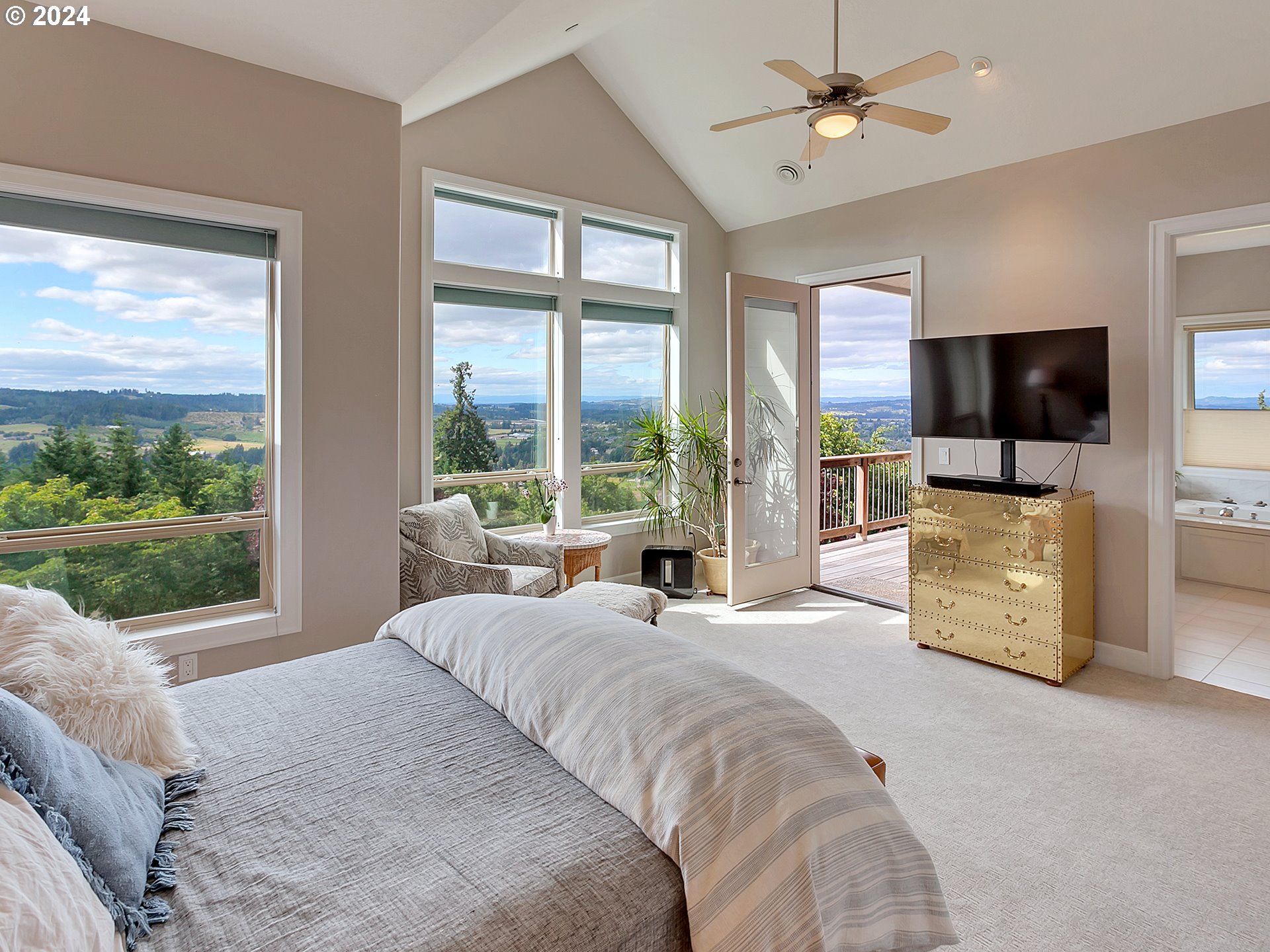 26317 Southwest Labrousse Road Sherwood, OR 97140 - Photo 17 of 38 a large bedroom with a bed and a television