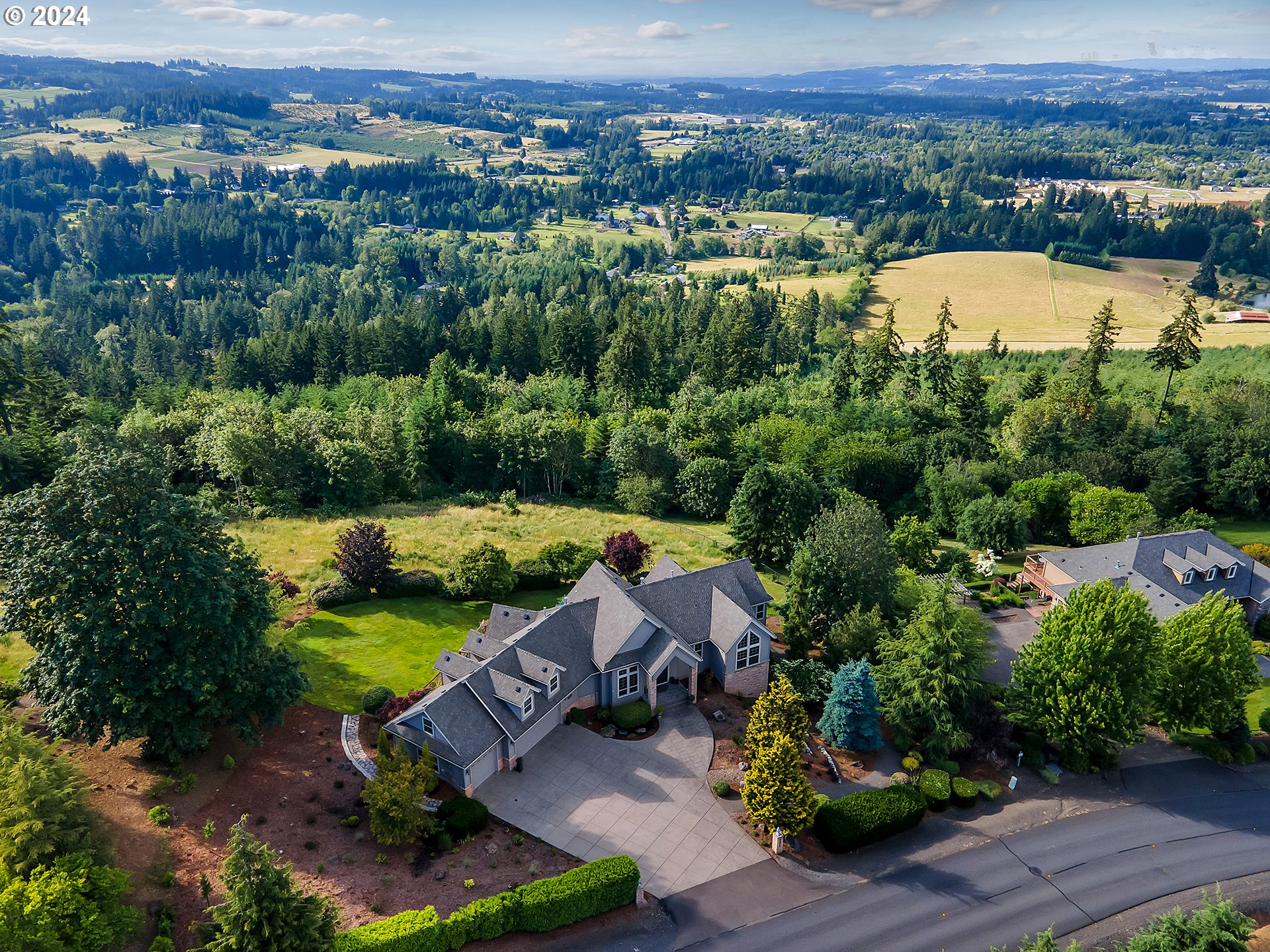 26317 Southwest Labrousse Road Sherwood, OR 97140 - Photo 35 of 38 an aerial view of a house with a garden and lake view