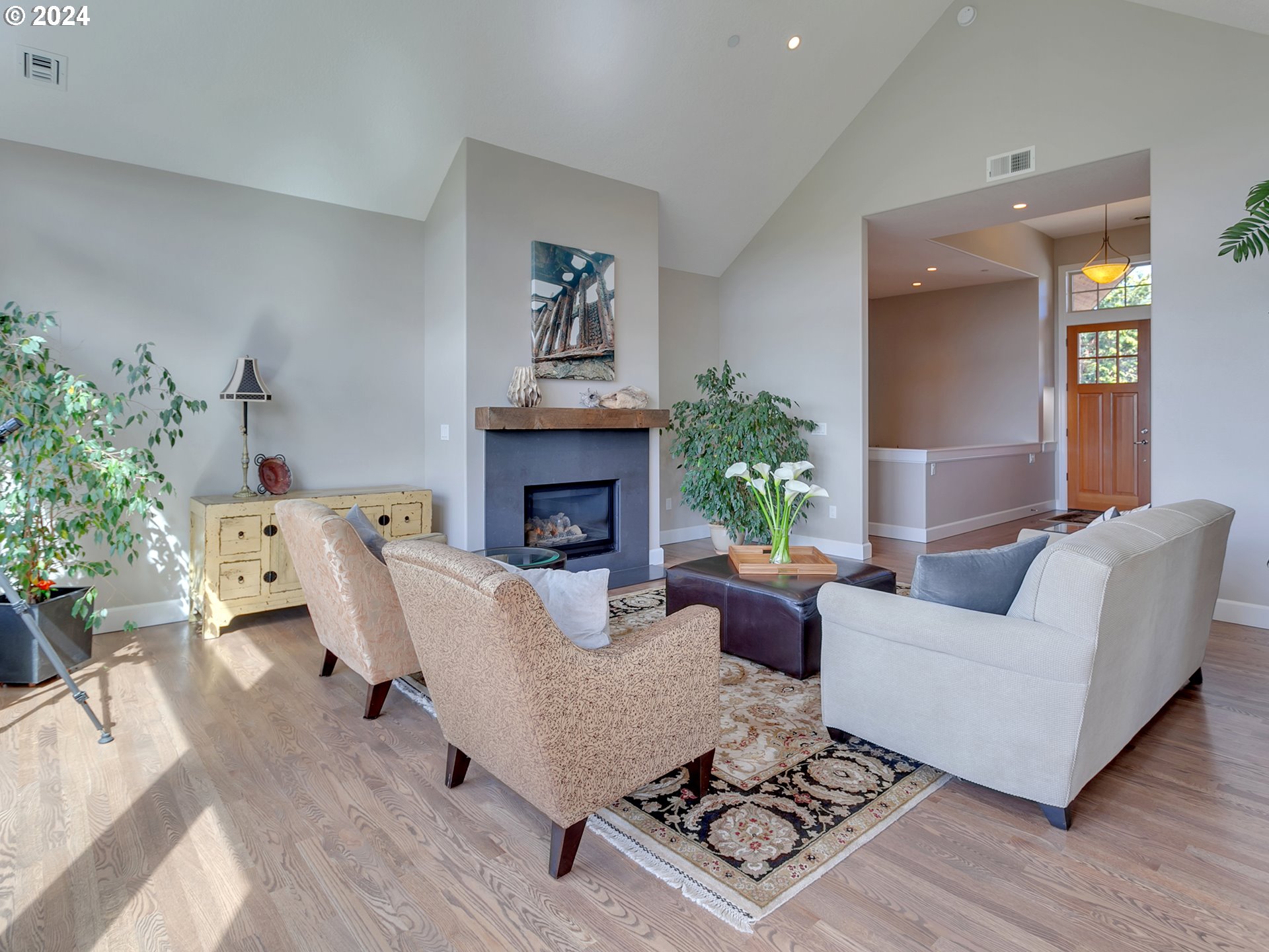 26317 Southwest Labrousse Road Sherwood, OR 97140 - Photo 7 of 38 a living room with furniture wooden floor and a fireplace