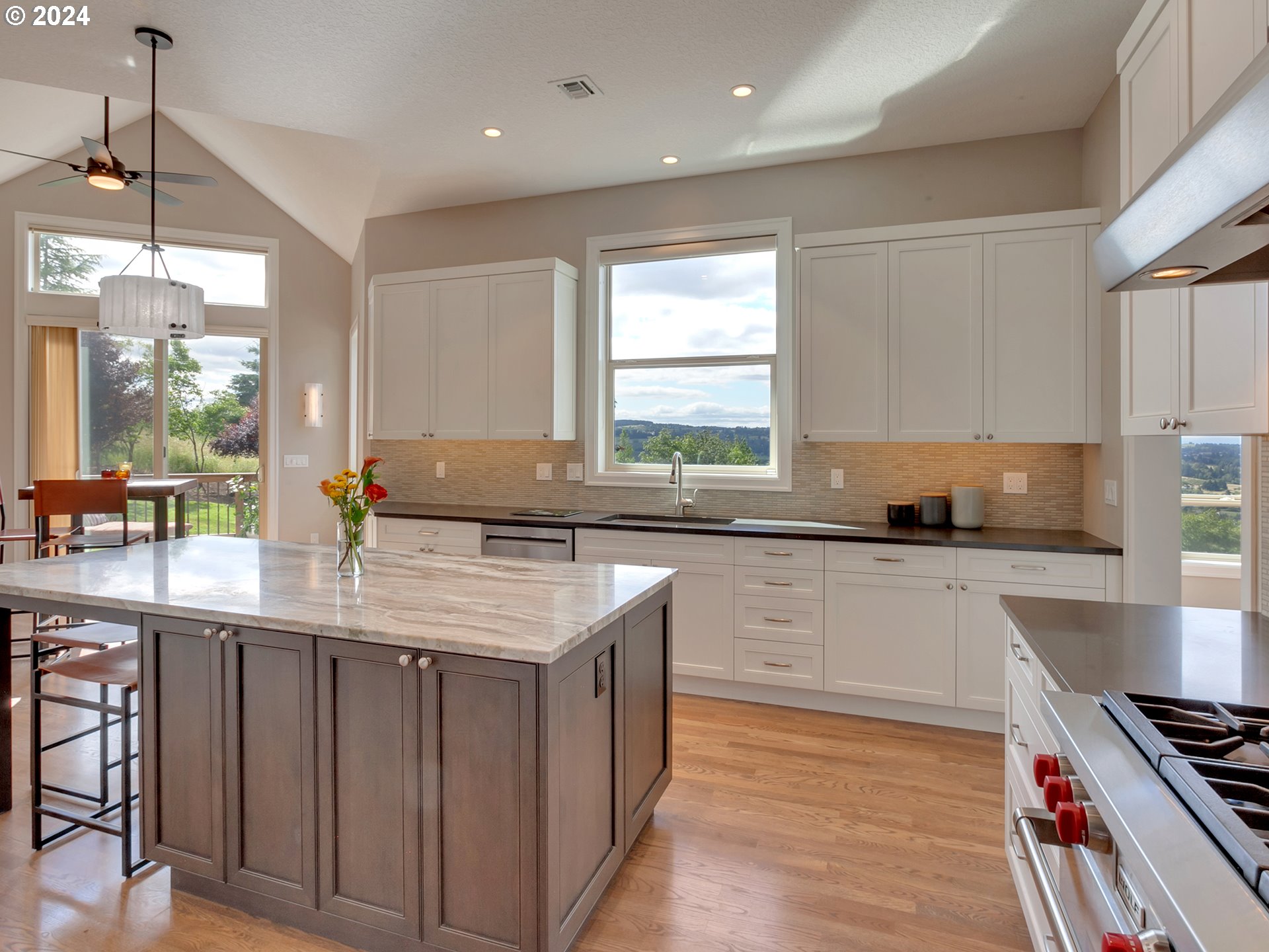 26317 Southwest Labrousse Road Sherwood, OR 97140 - Photo 10 of 38 a kitchen with stainless steel appliances granite countertop a sink stove and cabinets