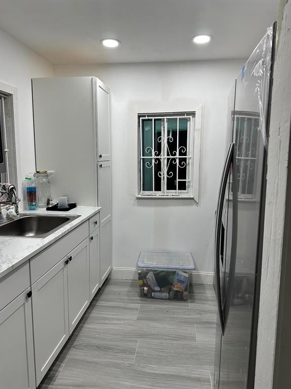 a bathroom with a sink a mirror and a shower