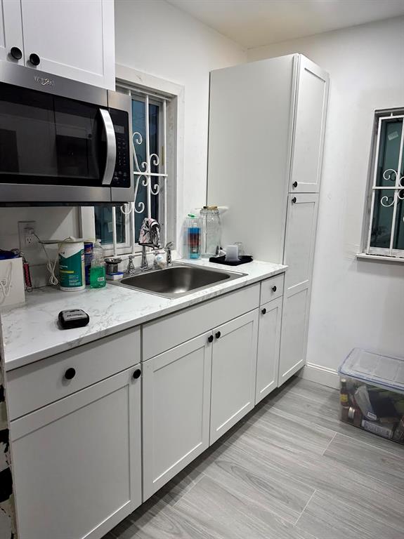 Pinewood Miami, FL 33150 - Photo 2 of 15 a kitchen with cabinets and window