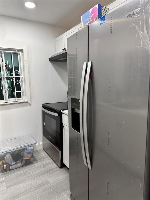 Pinewood Miami, FL 33150 - Photo 3 of 15 a metallic refrigerator freezer sitting in a kitchen