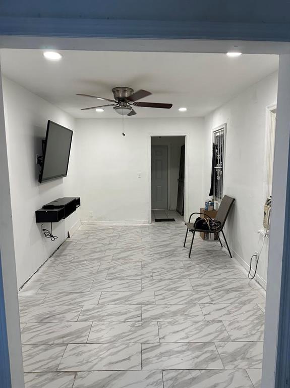 Pinewood Miami, FL 33150 - Photo 5 of 15 a view of a livingroom with furniture and a flat screen tv