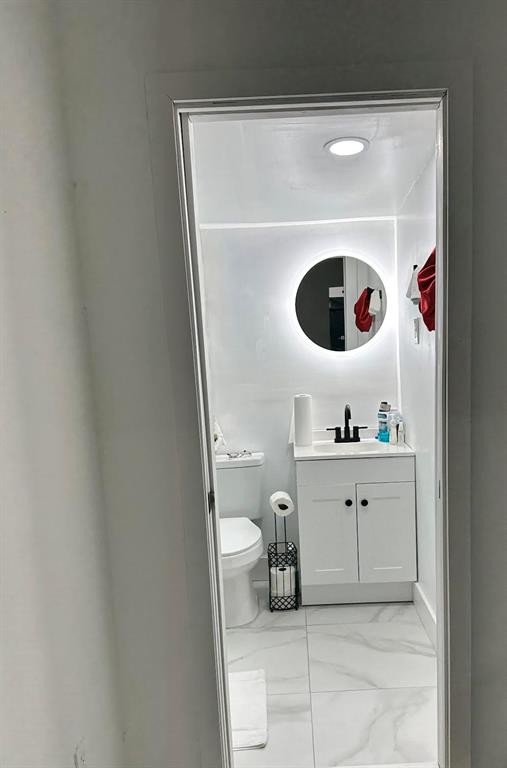 Pinewood Miami, FL 33150 - Photo 7 of 15 a bathroom with a toilet and a sink