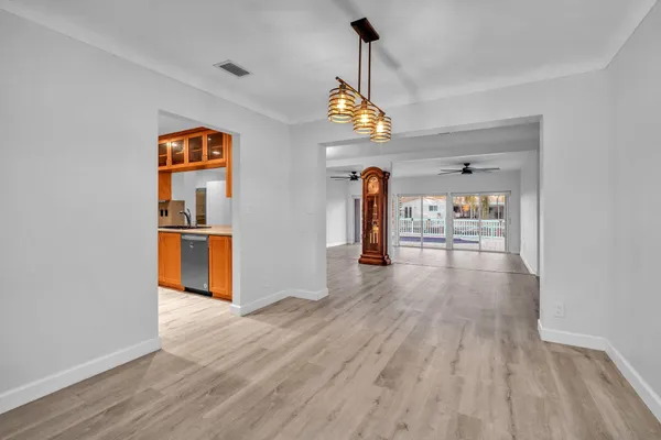 a large kitchen with stainless steel appliances granite countertop a stove a sink and a refrigerator