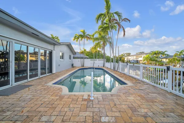 a view of swimming pool with a lounge chair