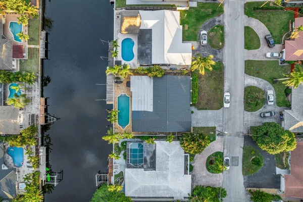 an aerial view of residential building and lake
