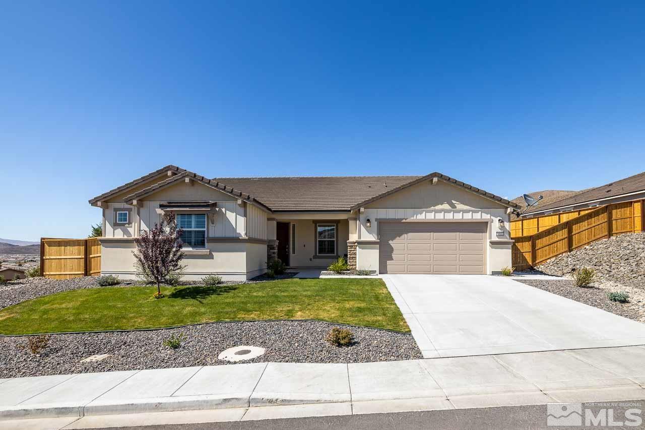 4501 High Pointe Drive Reno, NV 89521 - Photo 1 of 26 a front view of a house with a yard and garage