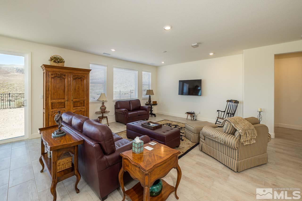 4501 High Pointe Drive Reno, NV 89521 - Photo 18 of 26 a living room with furniture and a flat screen tv