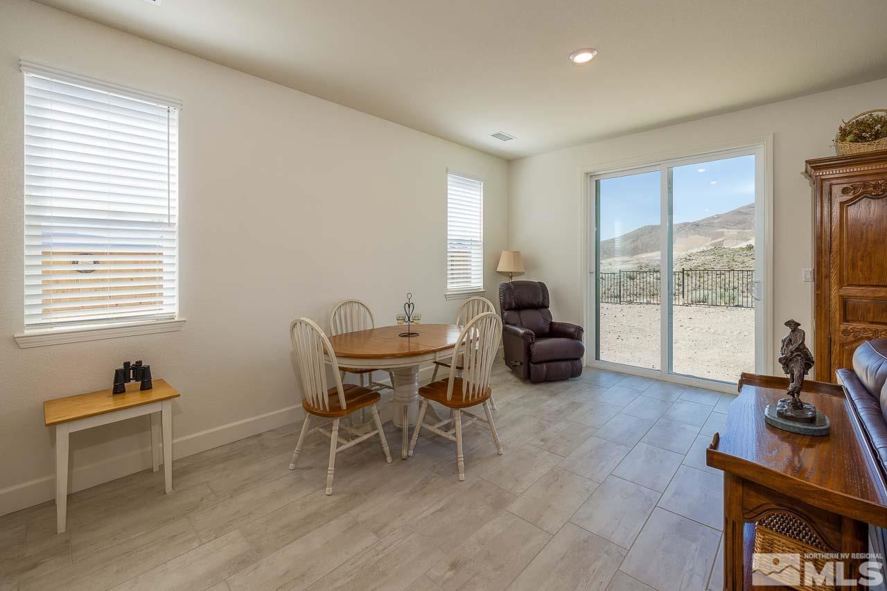 4501 High Pointe Drive Reno, NV 89521 - Photo 19 of 26 a living room with furniture a flat screen tv and a large window