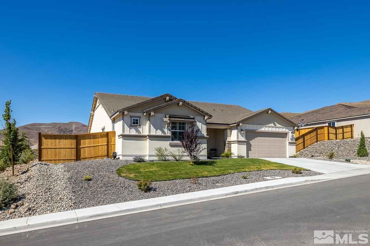4501 High Pointe Drive Reno, NV 89521 - Photo 3 of 26 a front view of a house with a yard and garage