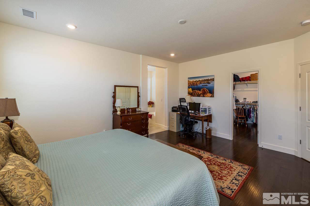 4501 High Pointe Drive Reno, NV 89521 - Photo 5 of 26 a bed room with a bed and a television