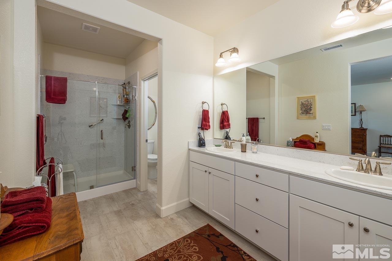4501 High Pointe Drive Reno, NV 89521 - Photo 6 of 26 a spacious bathroom with double vanity and a shower