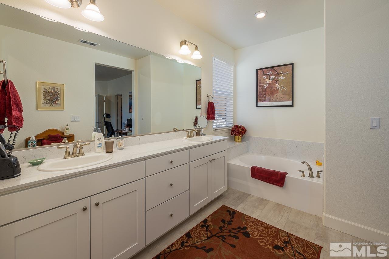 4501 High Pointe Drive Reno, NV 89521 - Photo 7 of 26 a bathroom with a sink and a mirror