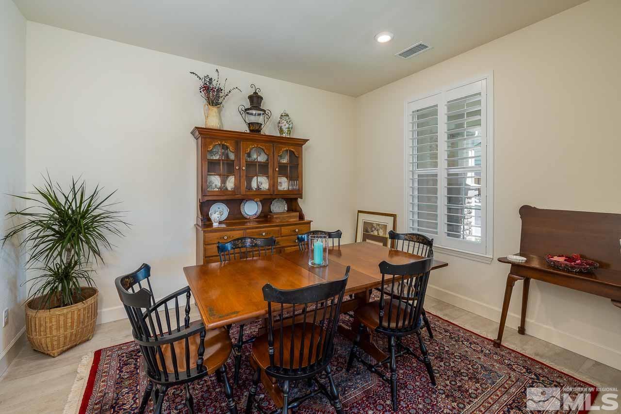4501 High Pointe Drive Reno, NV 89521 - Photo 9 of 26 a view of a dining room with furniture and wooden floor