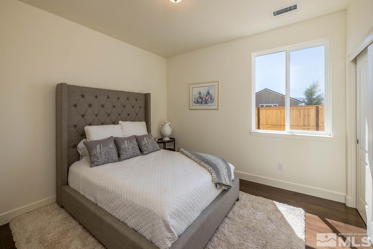 4501 High Pointe Drive Reno, NV 89521 - Photo 10 of 26 a bedroom with a bed and a window