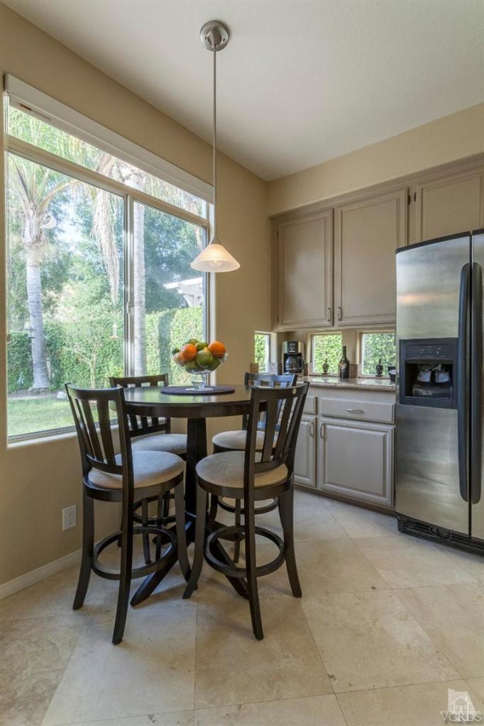 11137 Shadyridge Road Moorpark, CA 93021 - Photo 14 of 31 a kitchen with a table chairs and a window