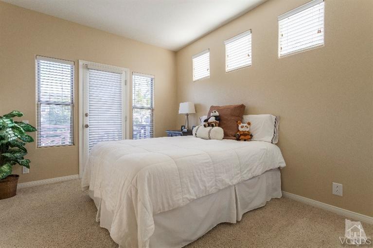 11137 Shadyridge Road Moorpark, CA 93021 - Photo 22 of 31 a bedroom with a bed and a potted plant