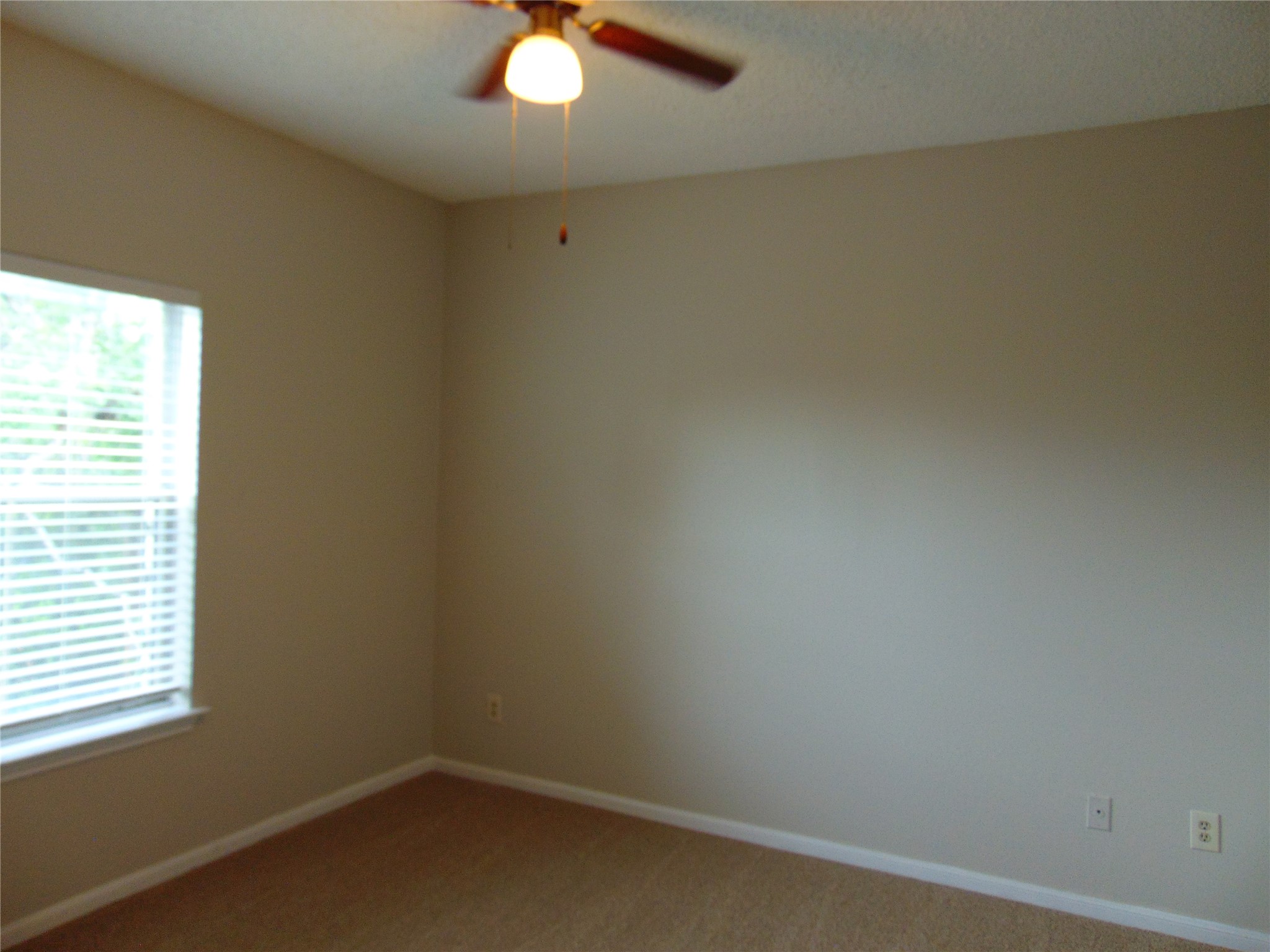 2508 Enfield Road, Unit 8 Austin, TX 78703 - Photo 12 of 16 an empty room with a window