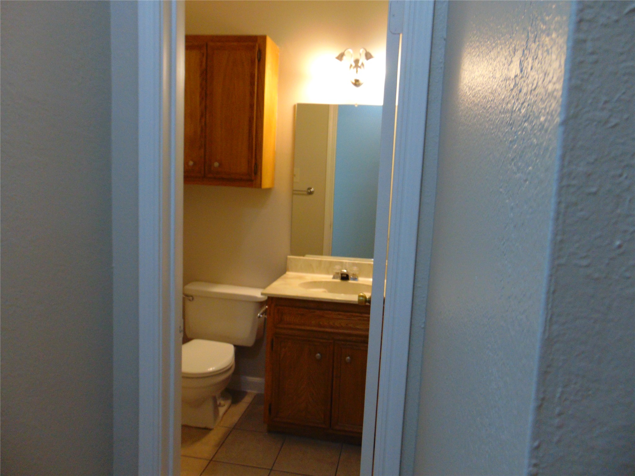 2508 Enfield Road, Unit 8 Austin, TX 78703 - Photo 16 of 16 a bathroom with a granite countertop sink and a mirror
