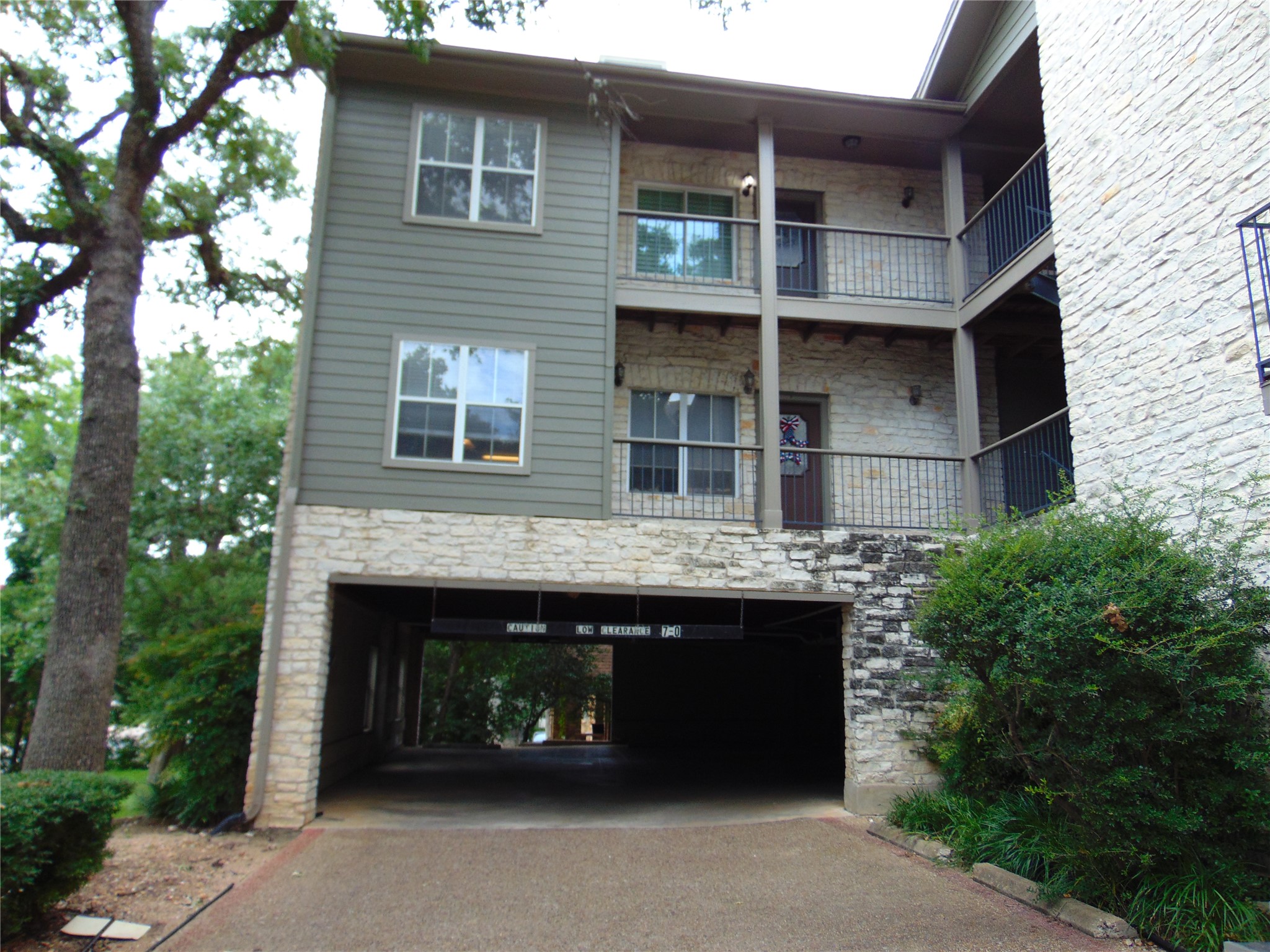 2508 Enfield Road, Unit 8 Austin, TX 78703 - Photo 2 of 16 a front view of a house with yard