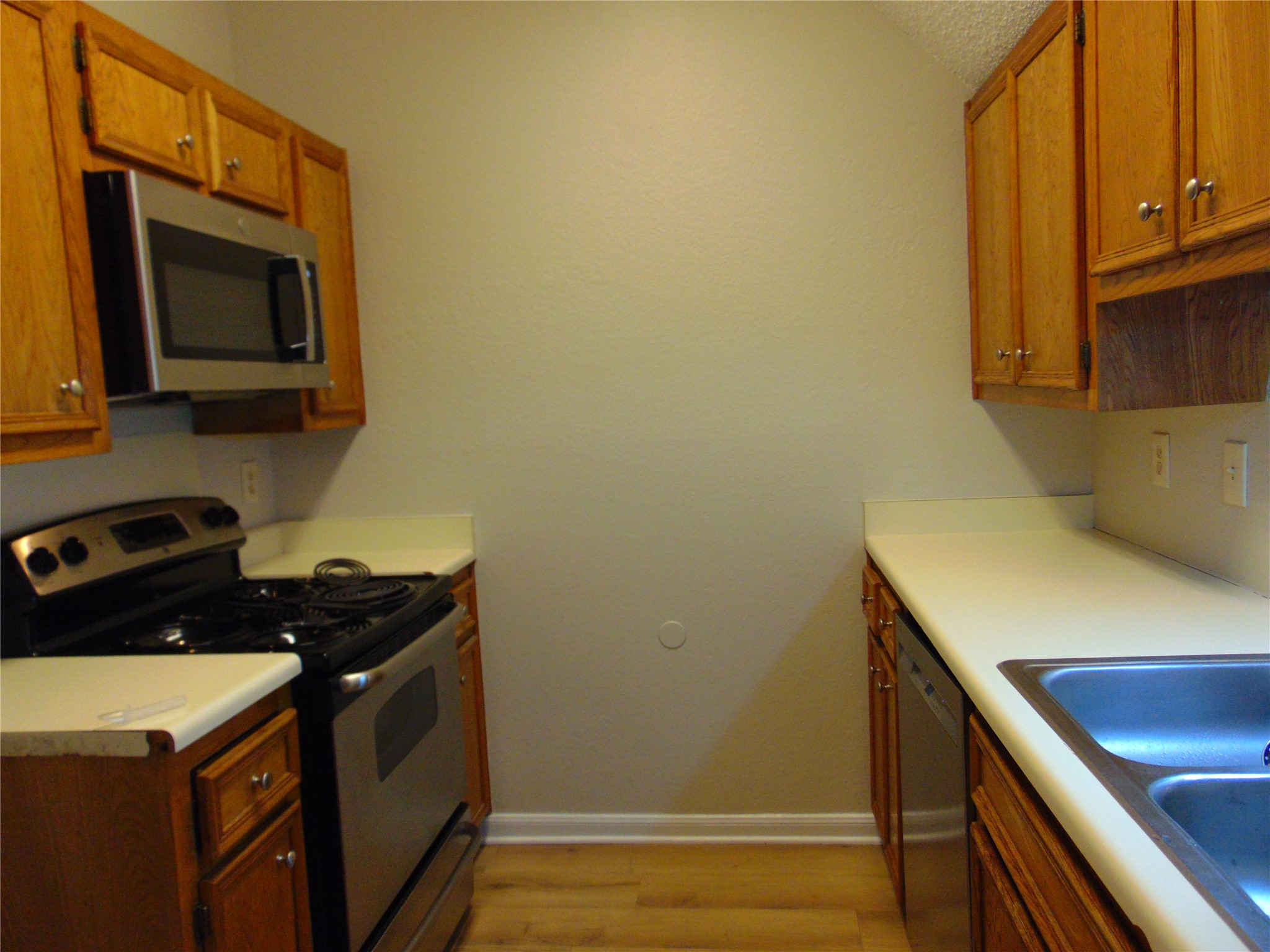 2508 Enfield Road, Unit 8 Austin, TX 78703 - Photo 9 of 16 a kitchen with a stove microwave and sink