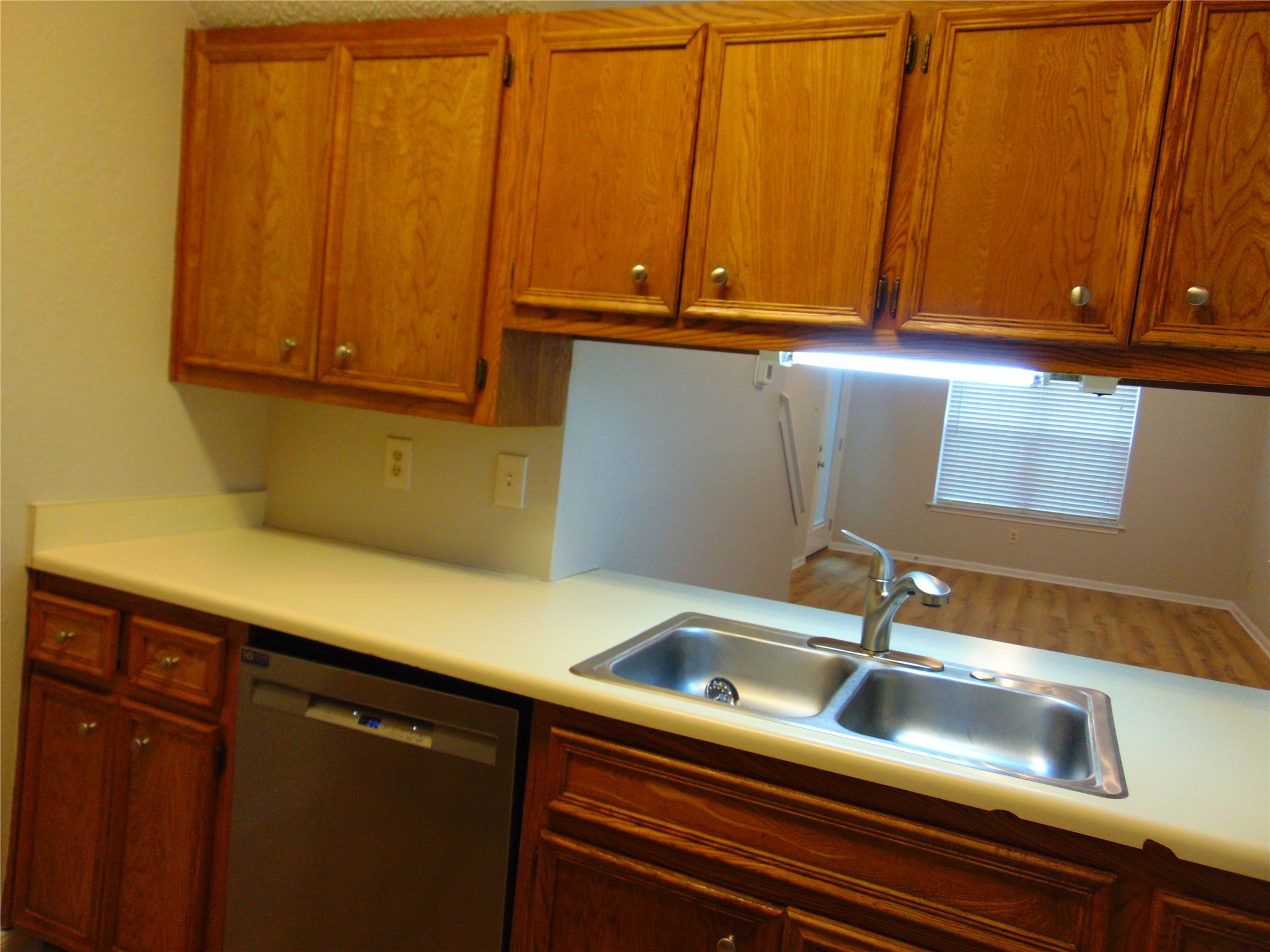 2508 Enfield Road, Unit 8 Austin, TX 78703 - Photo 10 of 16 a kitchen with a sink and cabinets