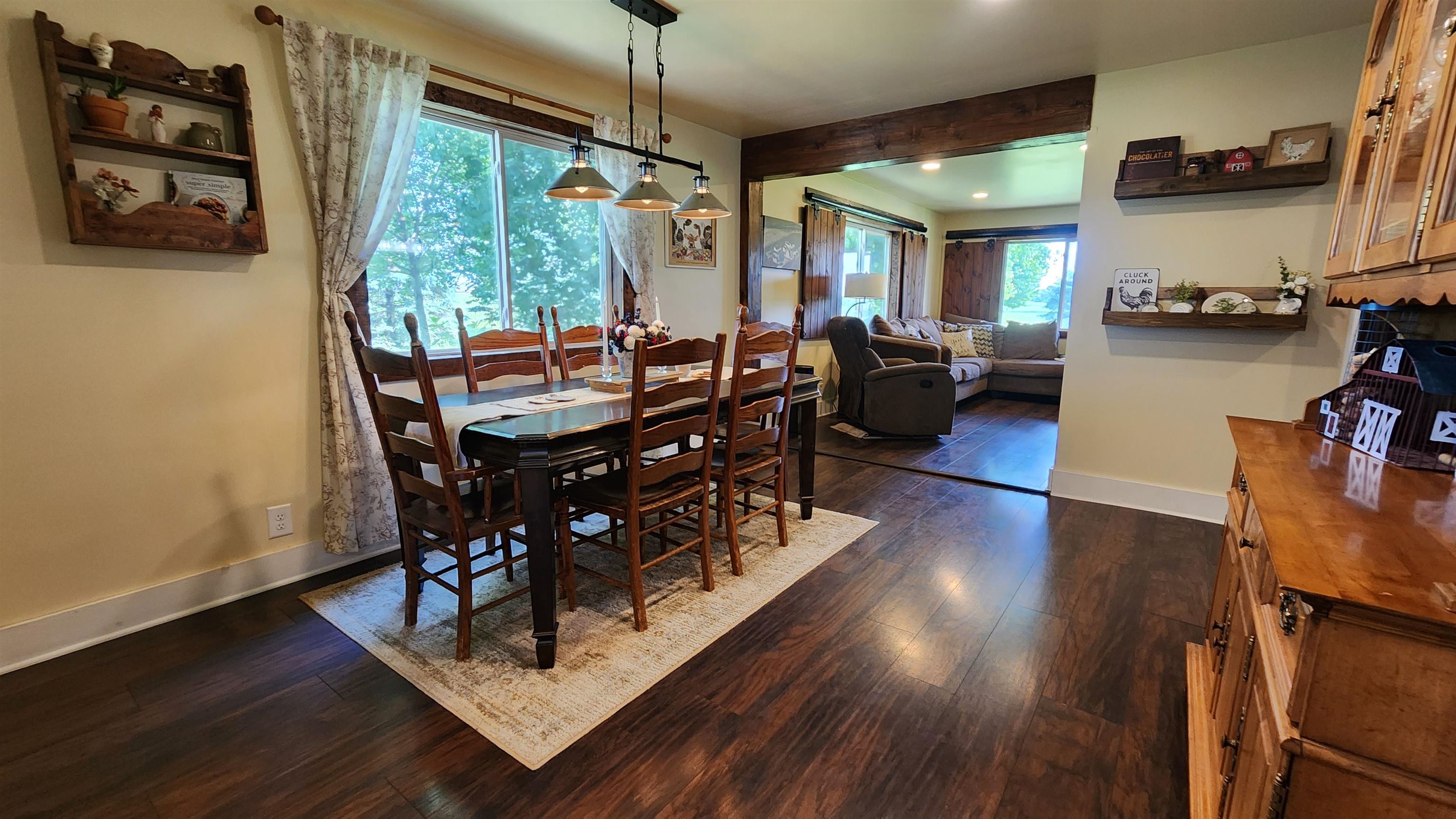 8999 Centerville Road Capron, IL 61012 - Photo 13 of 69 a view of a dining room with furniture window and wooden floor