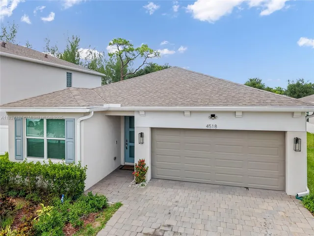 a front view of a house with a garage