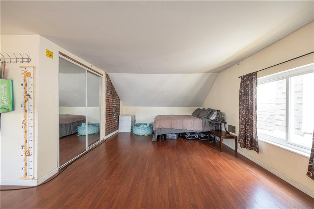 33 5th Street Pittsburgh, PA 15215 - Photo 20 of 32 a living room with furniture and a wooden floor