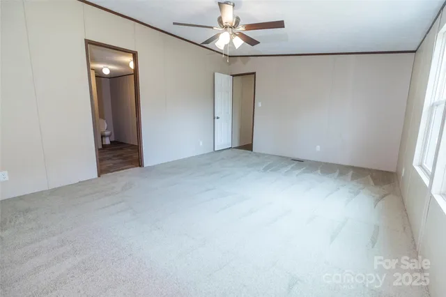 a bathroom with a granite countertop sink mirror and shower