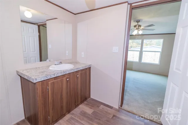 a view of a room with wooden floor