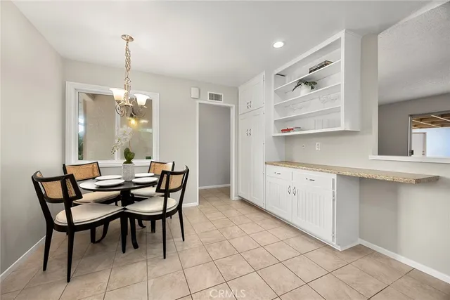 a view of a dining room with furniture and window