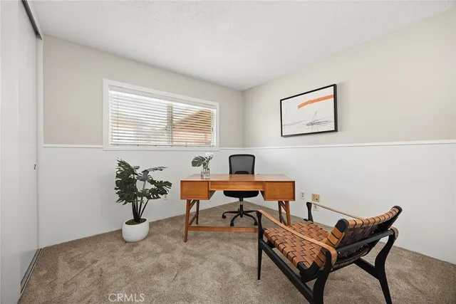 a reading room with furniture and window