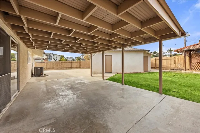 a view of a backyard of the house