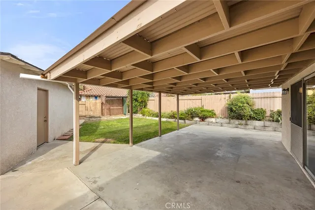 a view of a backyard of the house