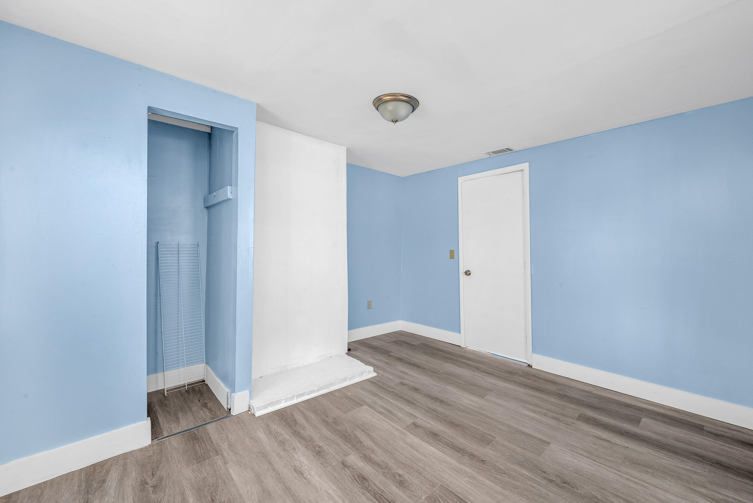 1497 Silver Beach Road Riviera Beach, FL 33404 - Photo 11 of 14 a view of an empty room with wooden floor