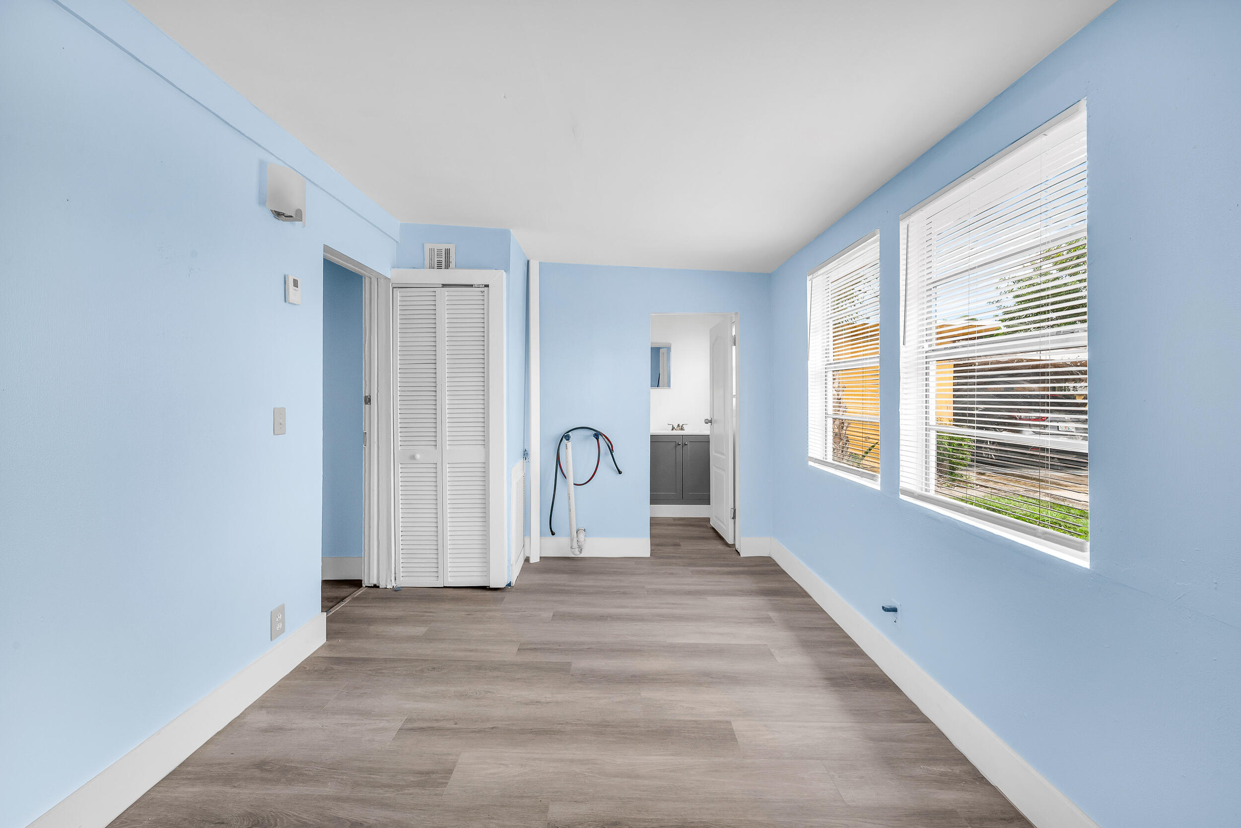 1497 Silver Beach Road Riviera Beach, FL 33404 - Photo 6 of 14 a view of a livingroom with wooden floor and a window