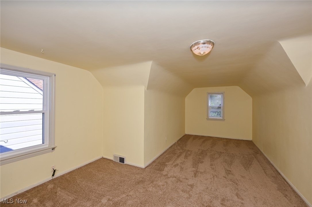 4033 Wyncote Road South Euclid, OH 44121 - Photo 15 of 25 Additional living space with lofted ceiling and light colored carpet