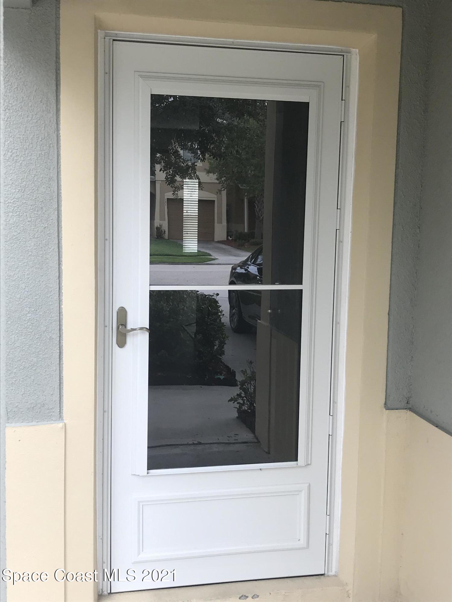 2780 Reston Street, Unit 103 Melbourne, FL 32935 - Photo 2 of 17 Storm door on front door