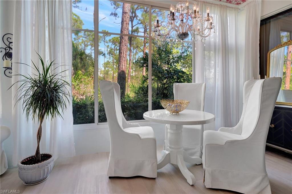 889 Carrick Bend Circle, Unit 1701 Naples, FL 34110 - Photo 18 of 32 a dining room with furniture and window
