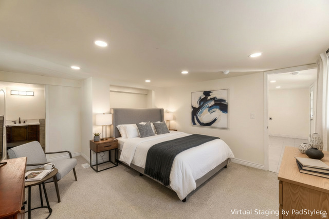 4658 Box Elder Street Salt Lake City, UT 84107 - Photo 5 of 17 Carpeted bedroom featuring recessed lighting, a built-in vanity with a dark wood-finish cabinet and black faucet, and an overhead light fixture