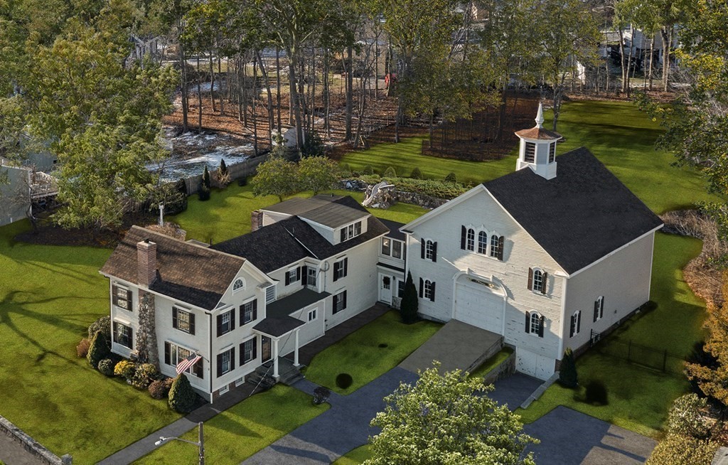 a aerial view of a house with a yard