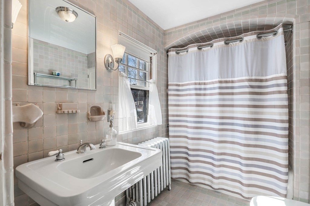 2 South Hampton Road Amesbury, MA 01913 - Photo 17 of 32 a bathroom with a sink and a mirror