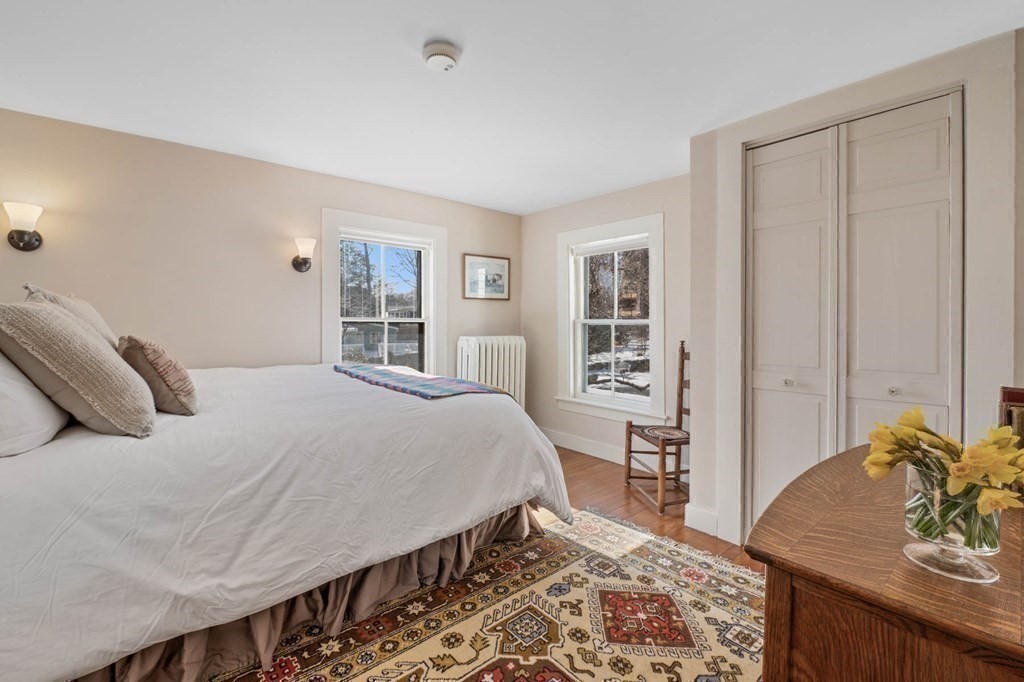 2 South Hampton Road Amesbury, MA 01913 - Photo 18 of 32 a bedroom with a large bed and a window