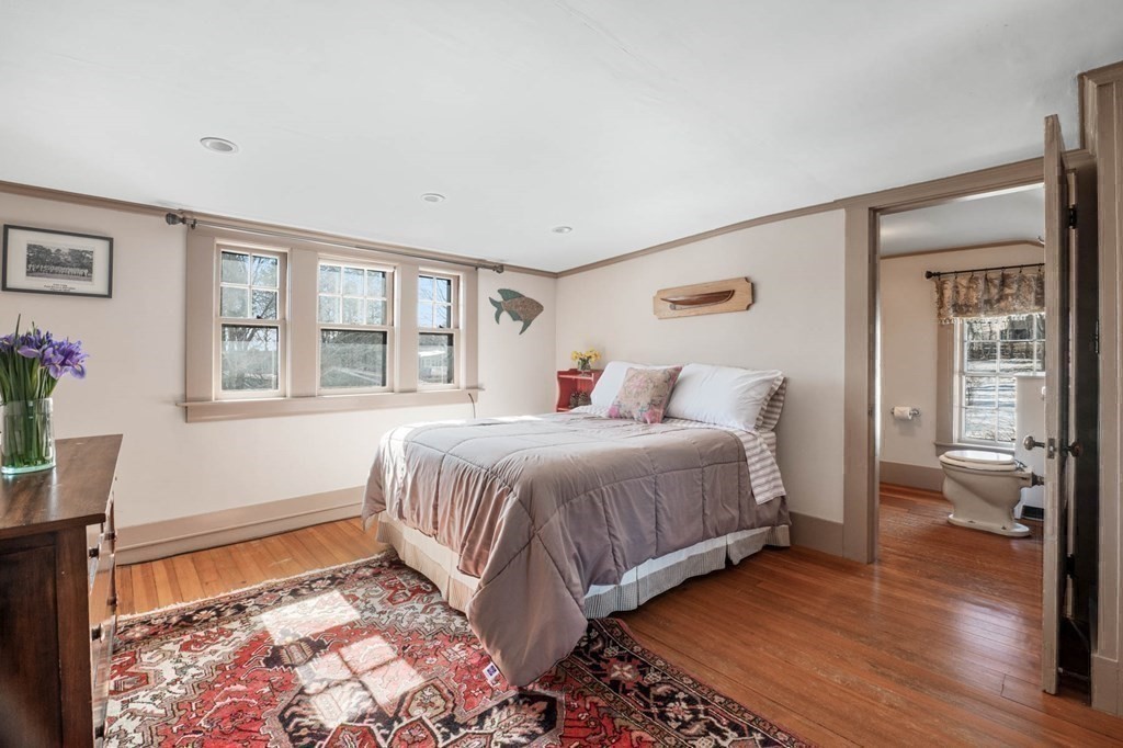 2 South Hampton Road Amesbury, MA 01913 - Photo 22 of 32 a bedroom with a bed and a window