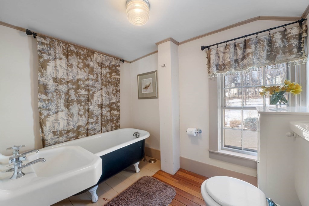 2 South Hampton Road Amesbury, MA 01913 - Photo 23 of 32 a bathroom with a sink toilet and shower