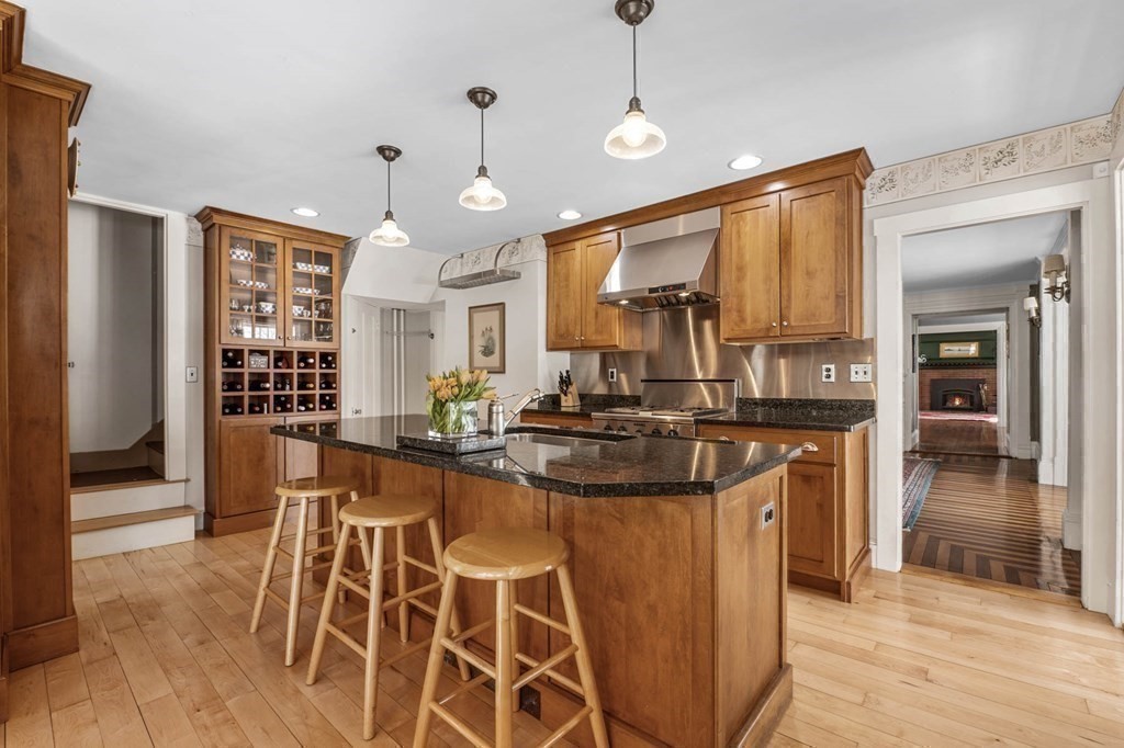 2 South Hampton Road Amesbury, MA 01913 - Photo 3 of 32 a kitchen with stainless steel appliances granite countertop a stove and a refrigerator